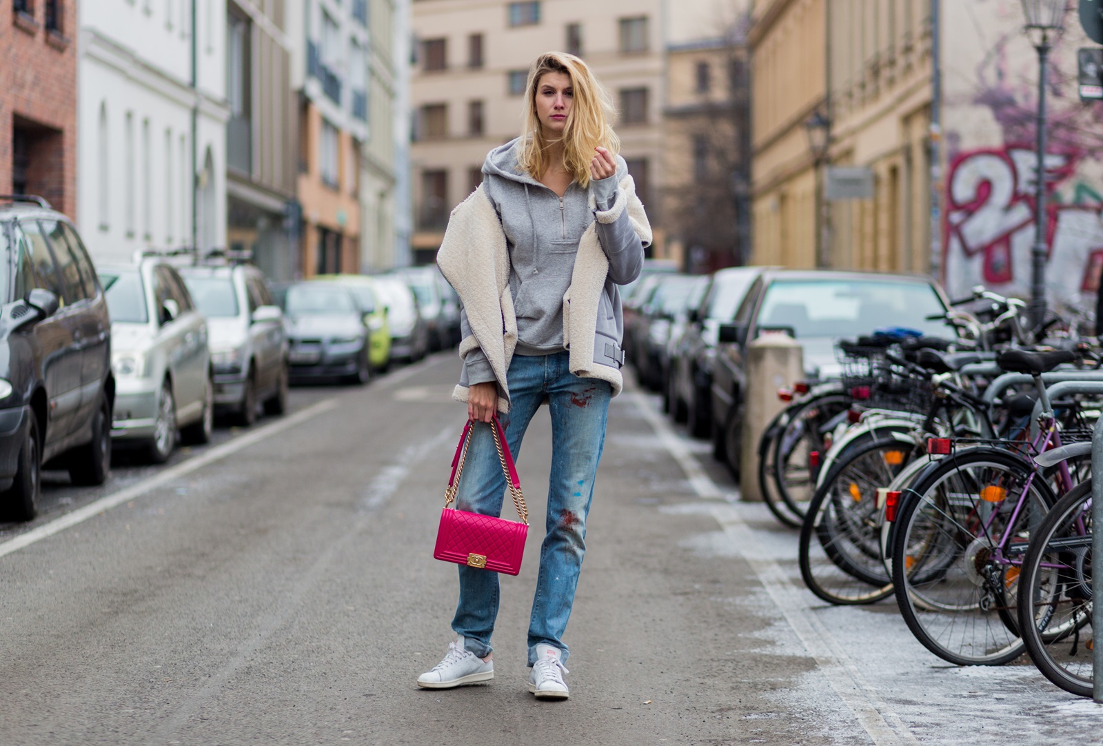 BERLIN, GERMANY - JANUARY 19: Kimyana Hachmann wearing Dior denim jeans, pink Chanel bag, Adidas Stan Smith sneaker, Zara jacket, Dolce & Gabbana hoody, during the Mercedes-Benz Fashion Week Berlin A/W 2017 at Kaufhaus Jandorf on January 19, 2017 in Berlin, Germany. (Photo by Christian Vierig/Getty Images) *** Local Caption *** Kimyana Hachmann