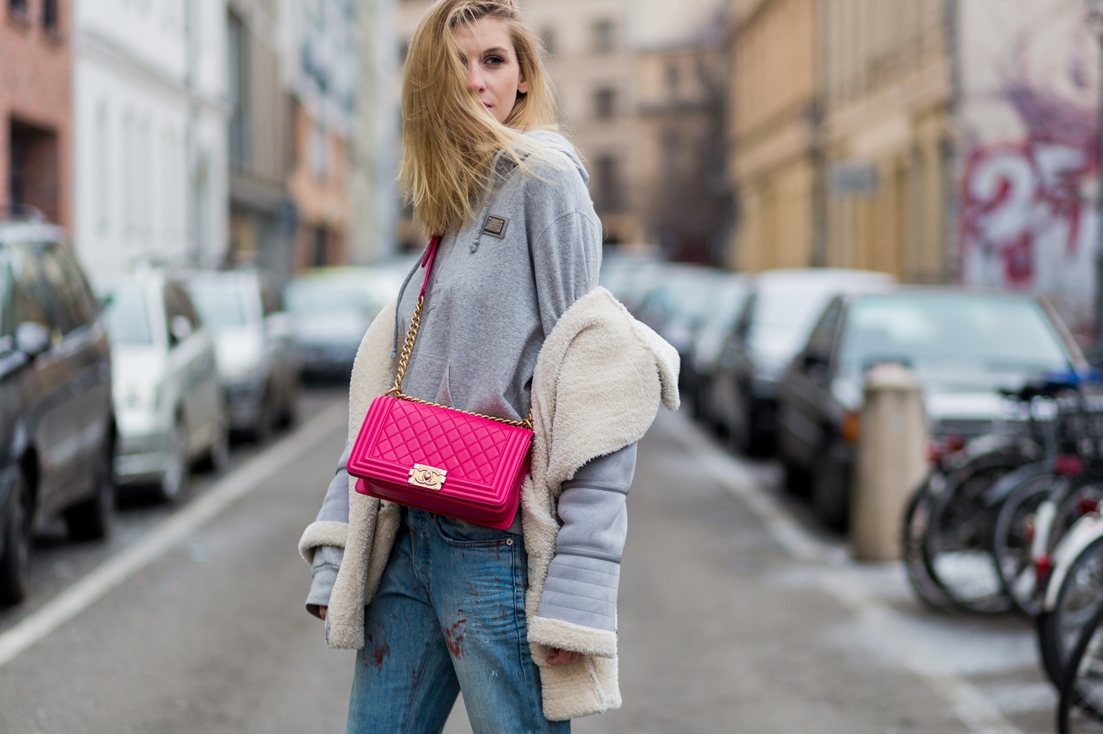 BERLIN, GERMANY - JANUARY 19: Kimyana Hachmann wearing Dior denim jeans, pink Chanel bag, Adidas Stan Smith sneaker, Zara jacket, Dolce & Gabbana hoody, during the Mercedes-Benz Fashion Week Berlin A/W 2017 at Kaufhaus Jandorf on January 19, 2017 in Berlin, Germany. (Photo by Christian Vierig/Getty Images) *** Local Caption *** Kimyana Hachmann