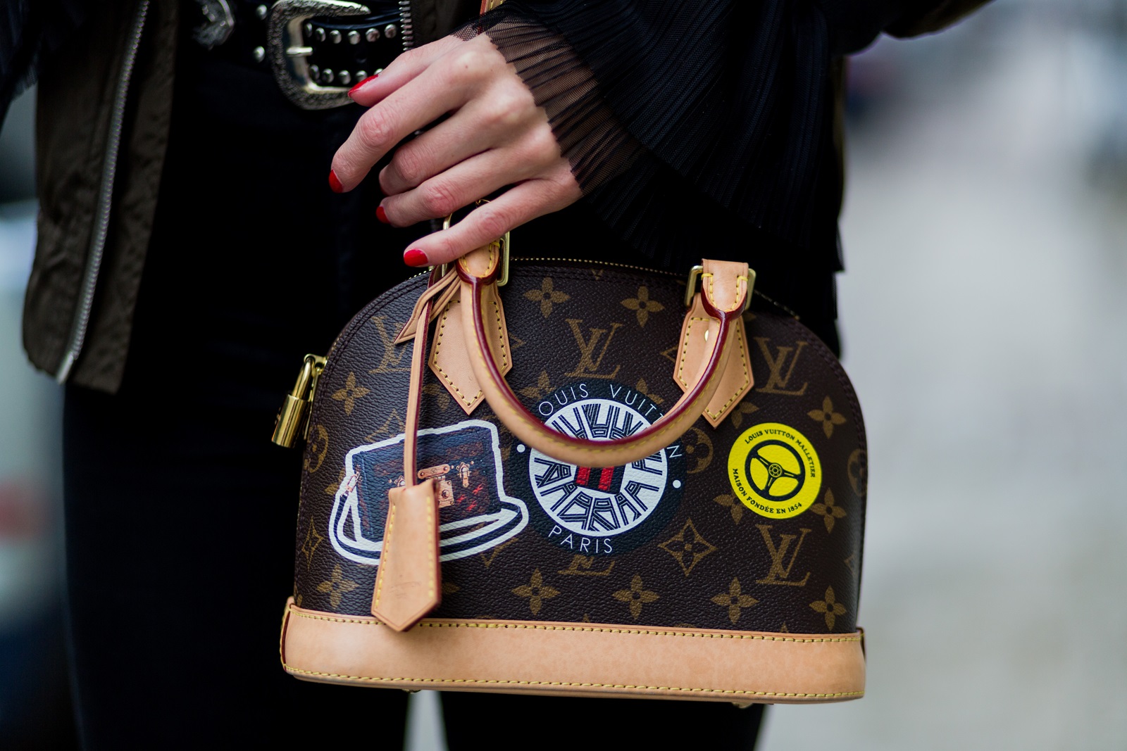 BERLIN, GERMANY - JANUARY 19: Kimyana Hachmann wearing a top and bomber jacket Zara, H&M pants, Mango ankle boots, Louis Vuitton bag, Chanel sunglasses during the Mercedes-Benz Fashion Week Berlin A/W 2017 at Kaufhaus Jandorf on January 19, 2017 in Berlin, Germany. (Photo by Christian Vierig/Getty Images) *** Local Caption *** Kimyana Hachmann